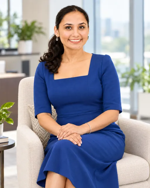 Raj Kiran Kaur seated in a cobalt dress
