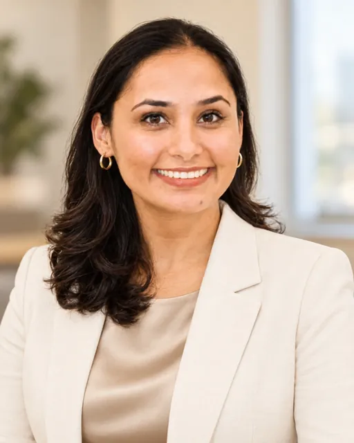 Raj Kiran Kaur in a cream blazer, office portrait